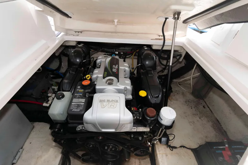 Slide: The Image of Engine compartment of a 2018 Monterey 295 Sport Yacht, featuring a Big Block V8 engine. - 18