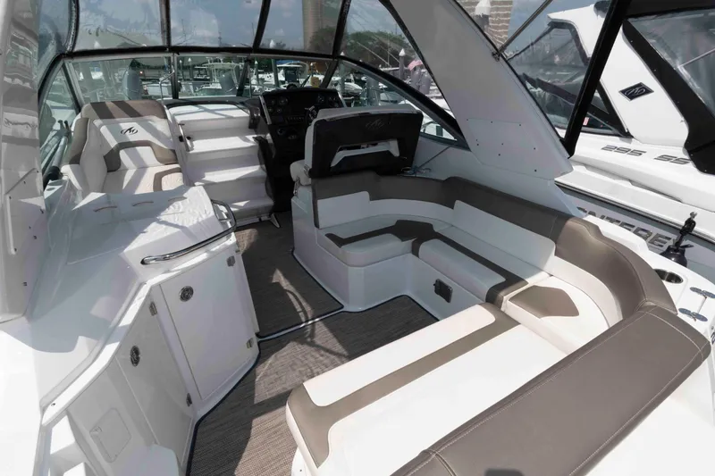 Slide: The Image of 2018 Monterey 295 Sport Yacht interior with sleek seating and modern design. - 4