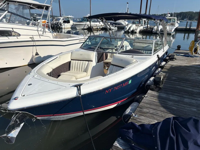 The Image of 2012 Cobalt A28 boat docked at marina, featuring sleek design and comfortable seating. - 0