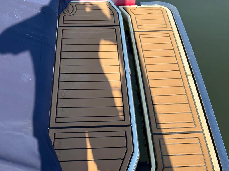 Slide: The Image of 2012 Cobalt A28 boat deck with brown and black striped design. - 12