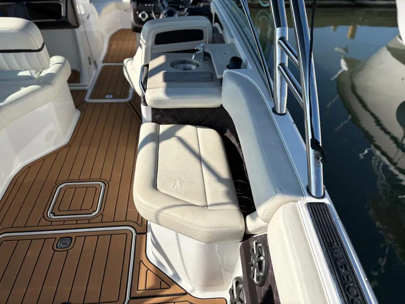 Slide: The Image of Interior of 2012 Cobalt A28 boat with white seating and teak flooring. - 9