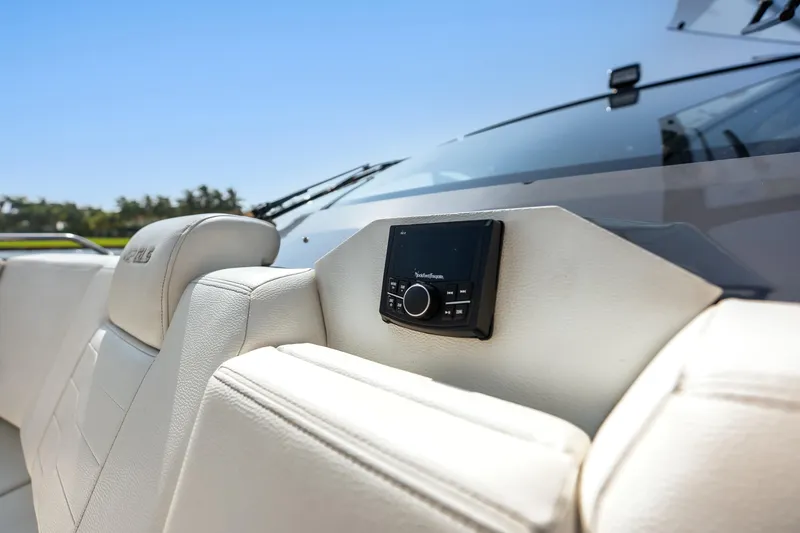 Slide: The Image of 2023 Cruisers Yachts 42 GLS OB interior with audio system and luxurious seating. - 17