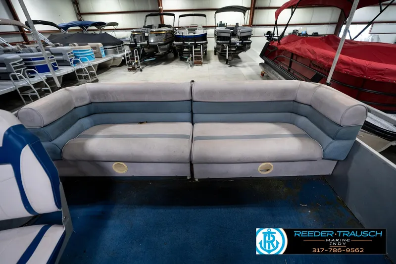 Slide: The Image of 1988 Landau 20 Adventurer boat stereo system with visible wear and Reeder-Trausch Marine contact details. - 27