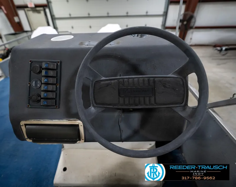 Slide: The Image of Blue and white seat in 1988 Landau 20 Adventurer boat, displayed indoors. - 30