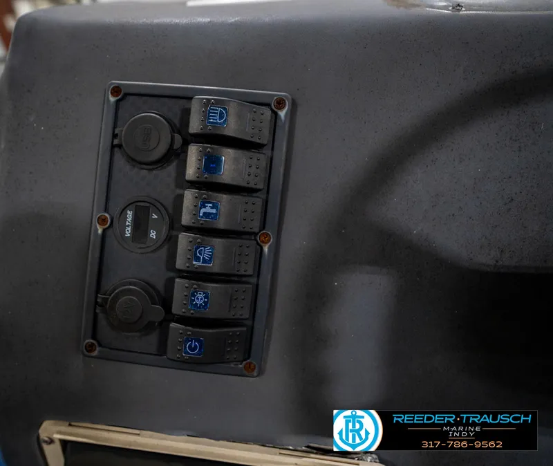 Slide: The Image of 1988 Landau 20 Adventurer boat interior with blue carpet and seating. - 31