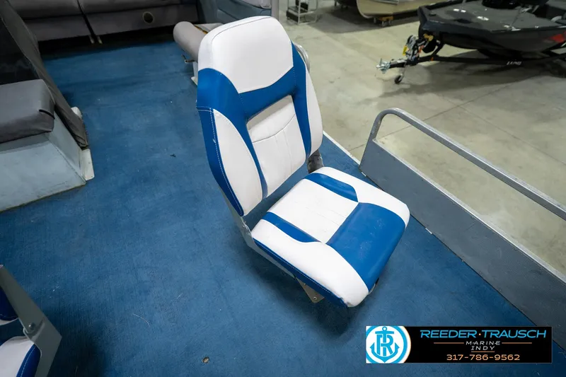 Slide: The Image of 1988 Landau 20 Adventurer boat propeller on trailer in a garage setting. - 38