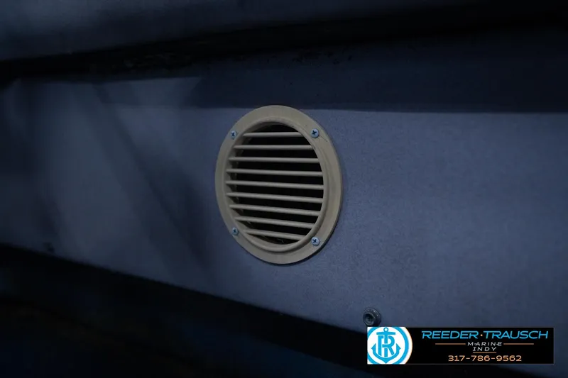 Slide: The Image of 1988 Landau 20 Adventurer boat with blue logo and textured surface. - 39