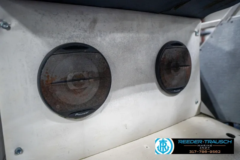 Slide: The Image of 1988 Landau 20 Adventurer trailer with rusted wheel on concrete floor. - 40