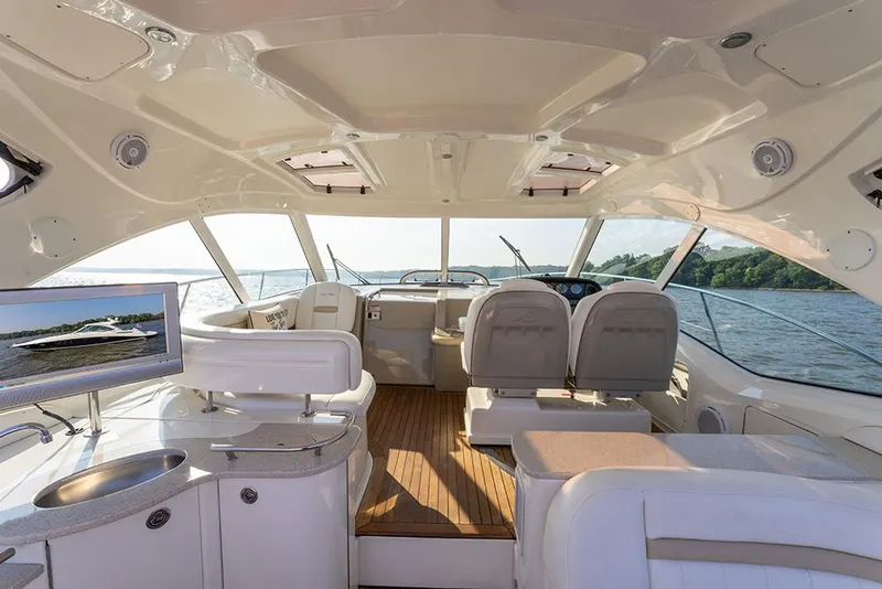 Slide: The Image of Interior view of 2008 Sea Ray 48 Sundancer yacht with luxurious seating and helm. - 13
