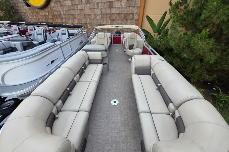 Slide: The Image of 2025 Sun Tracker Party Barge 24 DLX pontoon boat with spacious seating and modern design. - 2
