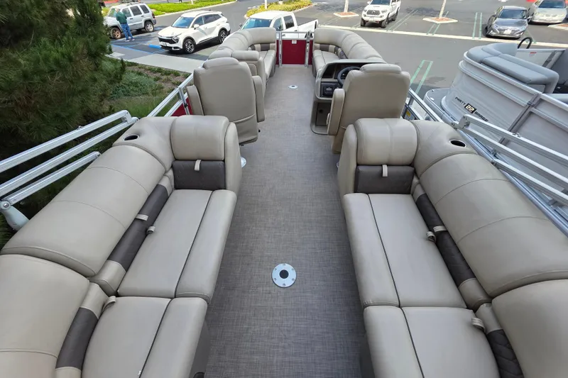 Slide: The Image of 2025 Sun Tracker Party Barge 24 DLX with spacious seating and modern design. - 3