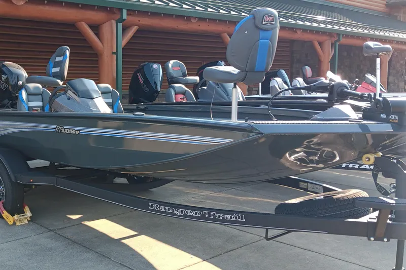 Slide: The Image of 2025 Ranger RT188P fishing boat on trailer, featuring sleek design and modern seating. - 1