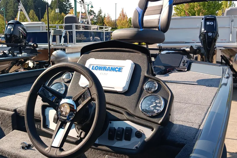 Slide: The Image of 2025 Ranger RT188P boat dashboard with Lowrance Elite display and Mercury engine. - 2