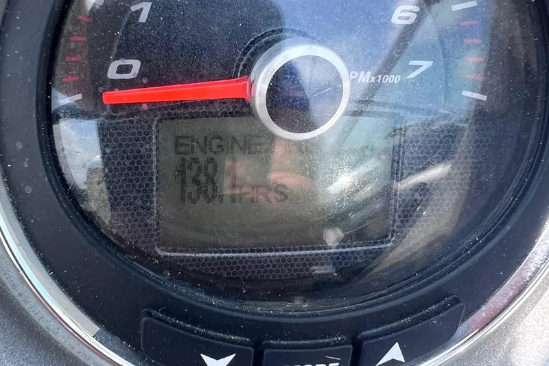 Slide: The Image of Interior view of 2015 Chaparral 224 Sunesta boat, featuring helm and seating area. - 10