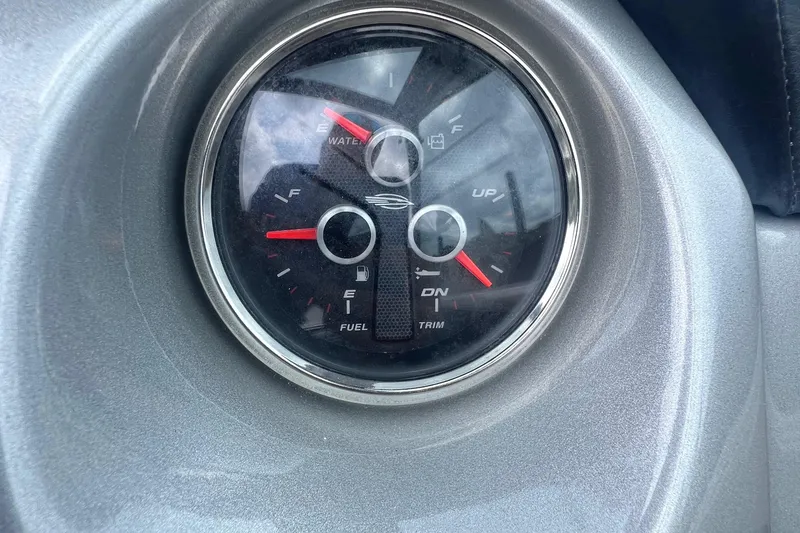 Slide: The Image of Interior of 2015 Chaparral 224 Sunesta boat with compact toilet and storage area. - 15