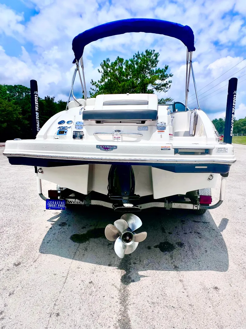 Slide: The Image of 2015 Chaparral 224 Sunesta boat stern with propeller, parked on concrete. - 6
