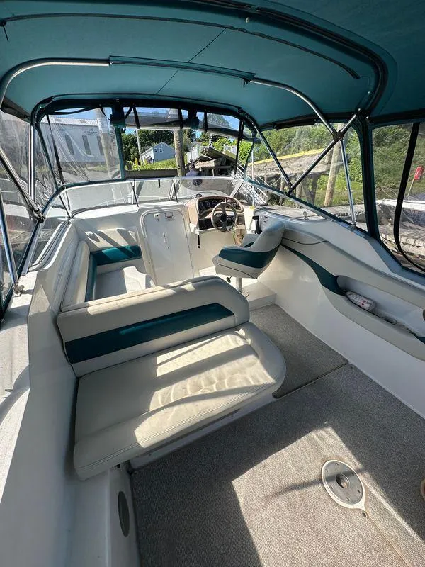 Slide: The Image of Interior of a 1998 Wellcraft 260 boat with seating and steering wheel. - 1