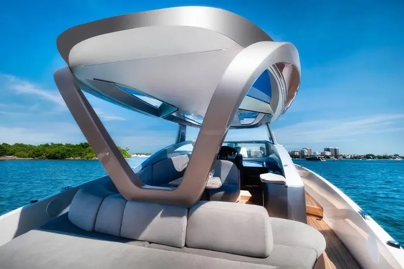 Slide: The Image of Luxury Tecnomar Evo 55 yacht, 2017 model, cruising on clear blue waters. - 14