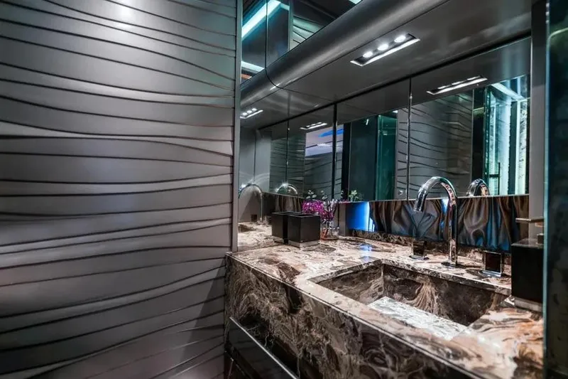 Slide: The Image of Luxurious bathroom interior on Tecnomar Evo 55 yacht, featuring marble countertop and modern fixtures. - 18