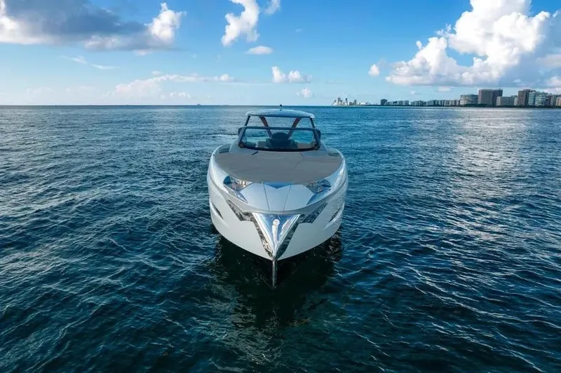 Slide: The Image of Tecnomar Evo 55 yacht on open sea, 2017 model, under clear blue sky. - 20