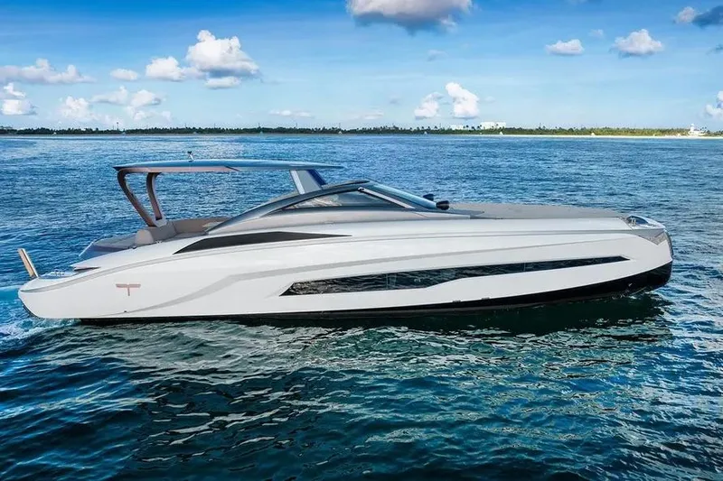 Slide: The Image of Tecnomar Evo 55 yacht cruising on open water, 2017 model, sleek design. - 4