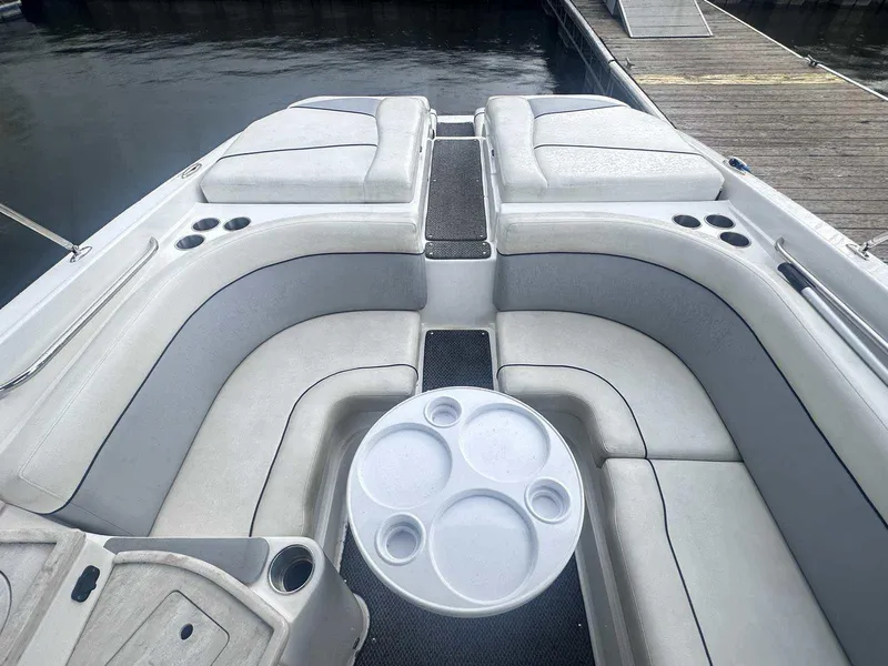Slide: The Image of 2015 Rinker 276 Captiva Bowrider interior with spacious seating and cup holders. - 13
