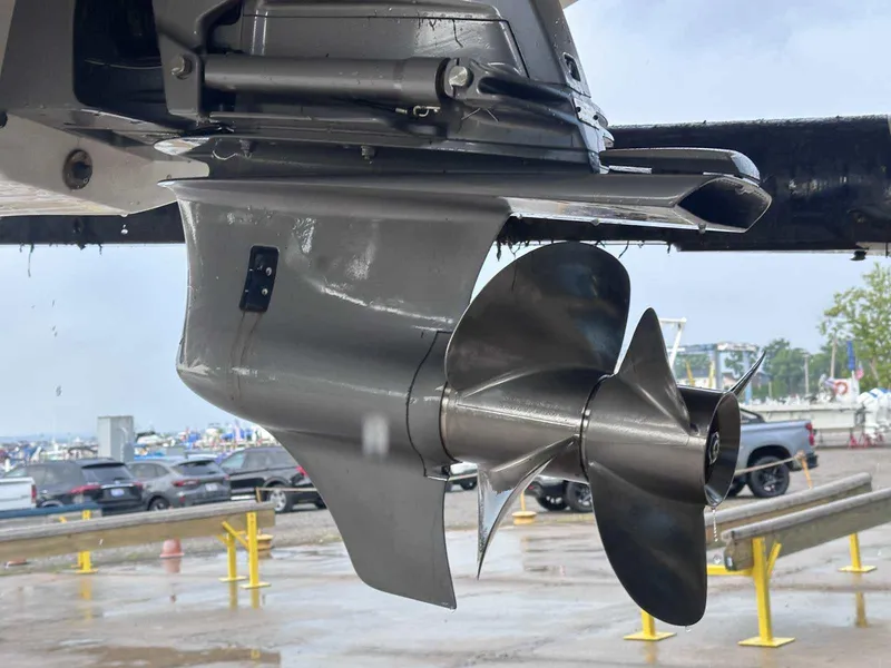 Slide: The Image of Close-up of a 2015 Rinker 276 Captiva Bowrider propeller at a marina. - 2