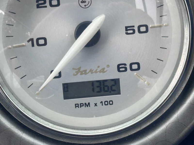 Slide: The Image of Tachometer of 2015 Rinker 276 Captiva Bowrider showing 1362 RPM. - 24