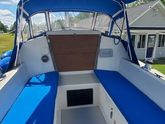 Slide: The Image of 1987 O'Day 272 sailboat cockpit with blue cushions and canopy. - 18