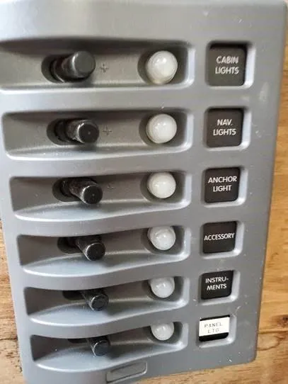 Slide: The Image of Control panel with switches for cabin, navigation, anchor lights on 1987 O'Day 272 boat. - 30