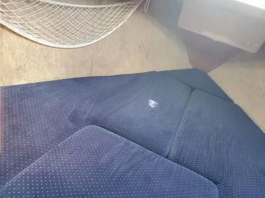 Slide: The Image of Interior cabin of 1987 O'Day 272 sailboat with blue cushions and storage net. - 35