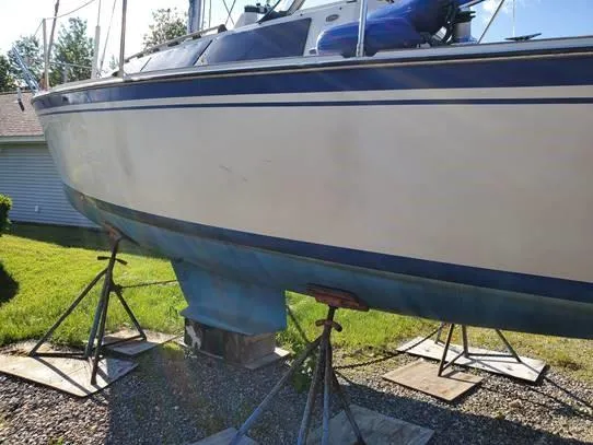 Slide: The Image of 1987 O'Day 272 sailboat on stands, side view, outdoors. - 9