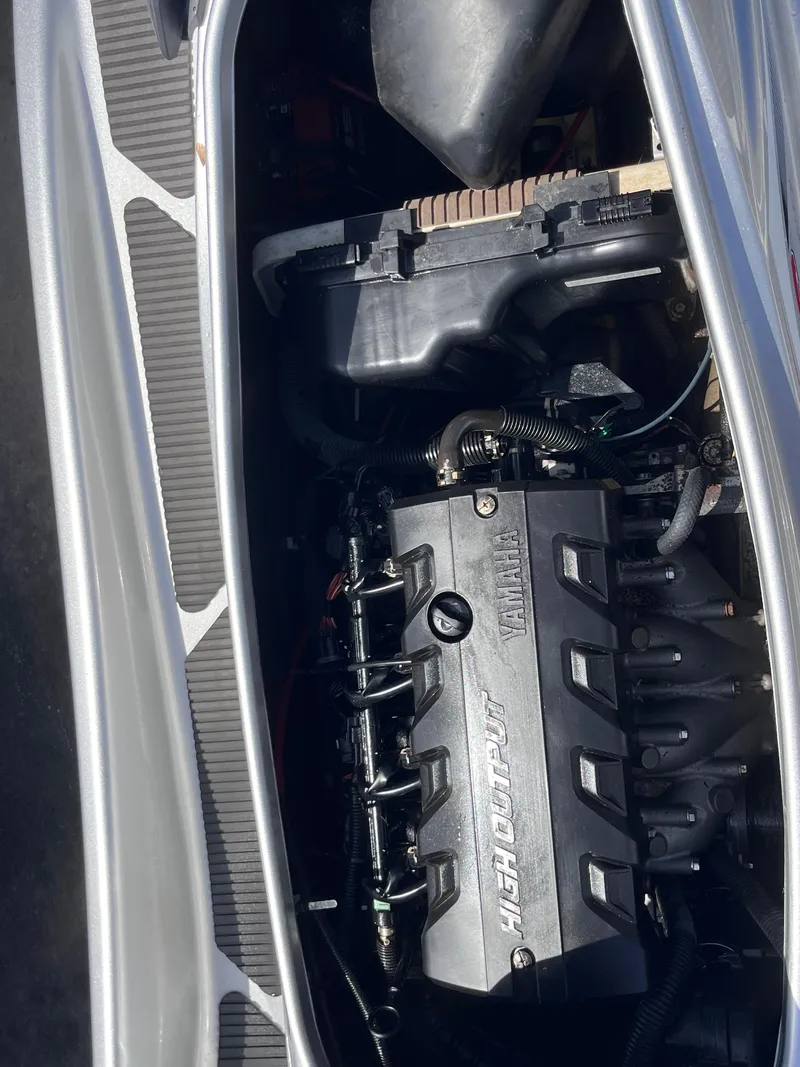 Slide: The Image of 2014 Yamaha WaveRunner VXR engine compartment, showcasing high-output engine components. - 11