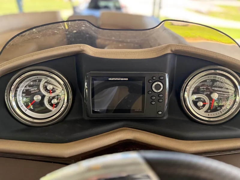 Slide: The Image of Dashboard of 2016 Coach Pontoons 25RF with gauges and Humminbird GPS. - 8