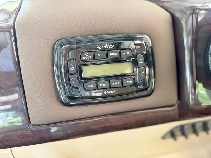 Slide: The Image of Infinity stereo system on 2016 Coach Pontoons 25RF dashboard. - 9