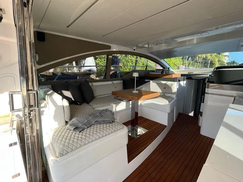 Slide: The Image of Luxurious interior of a 2019 Schaefer 510 yacht with elegant seating and wooden flooring. - 13