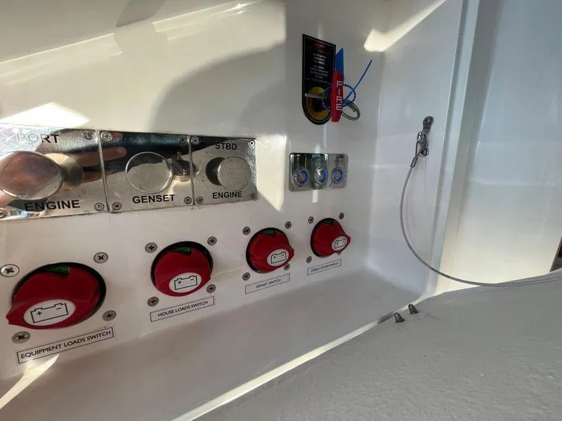 Slide: The Image of Control panel of a 2019 Schaefer 510 yacht with switches and labels. - 18