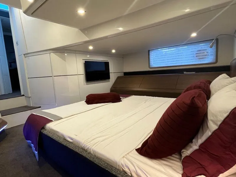 Slide: The Image of Luxurious cabin interior of 2019 Schaefer 510 yacht with modern design and cozy bedding. - 36