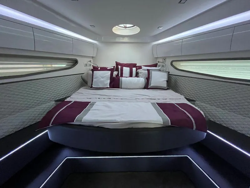 Slide: The Image of Luxurious cabin interior of 2019 Schaefer 510 yacht with elegant bedding and ambient lighting. - 40
