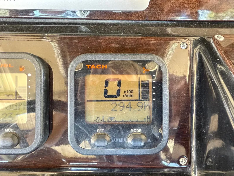Slide: The Image of Tachometer display on a 2013 Blackwood 27 boat, showing 0 RPM and 294.3 hours. - 11
