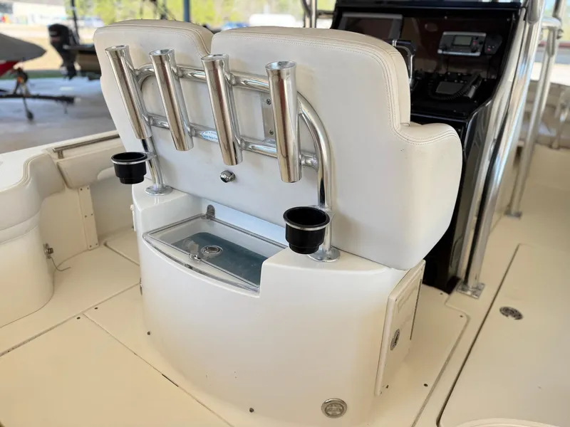 Slide: The Image of 2013 Blackwood 27 boat interior with rod holders and cup holders. - 14