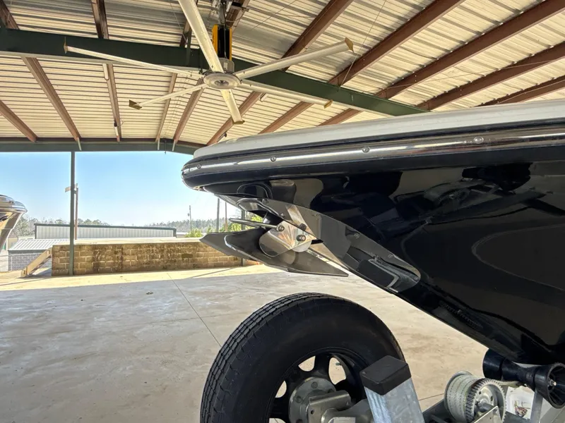 Slide: The Image of Blackwood 27 boat from 2013 on a trailer in a covered storage area. - 21