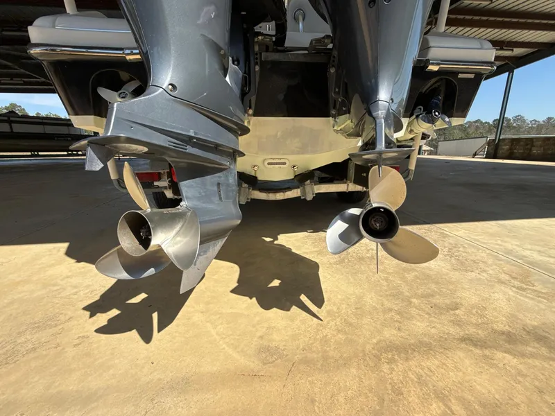 Slide: The Image of Rear view of a 2013 Blackwood 27 boat with dual outboard motors. - 22