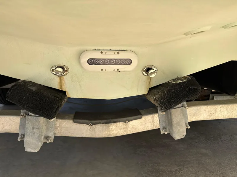 Slide: The Image of Rear view of a 2013 Blackwood 27 boat on a trailer, showing underwater lights. - 23