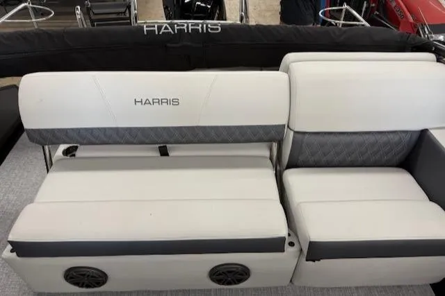 Slide: The Image of 2025 Harris Sunliner 230 boat seating with white and gray upholstery. - 14
