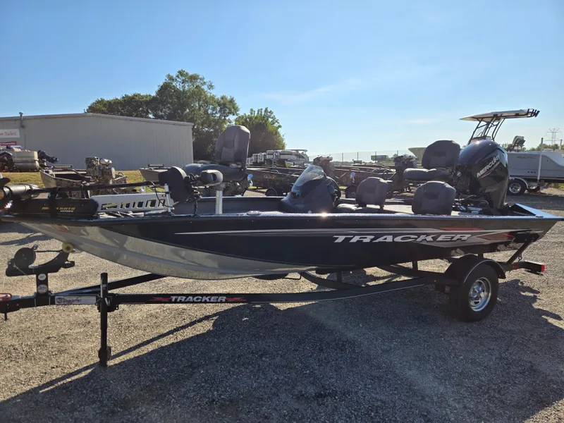 The Image of 2023 Tracker Pro Team 175 TF fishing boat on trailer, parked outdoors. - 0