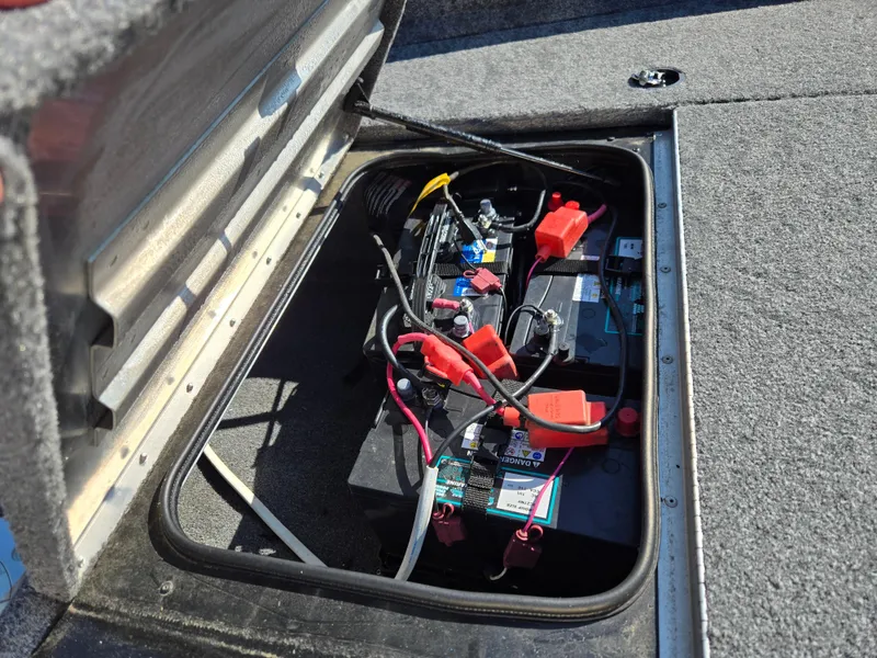 Slide: The Image of 2023 Tracker Pro Team 175 TF boat battery compartment with wiring and connections. - 12