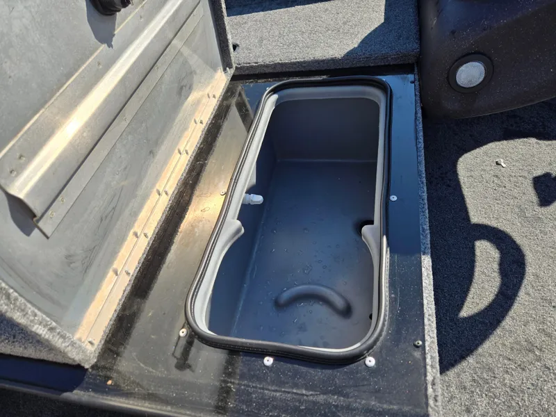 Slide: The Image of Open storage compartment in 2023 Tracker Pro Team 175 TF boat. - 13