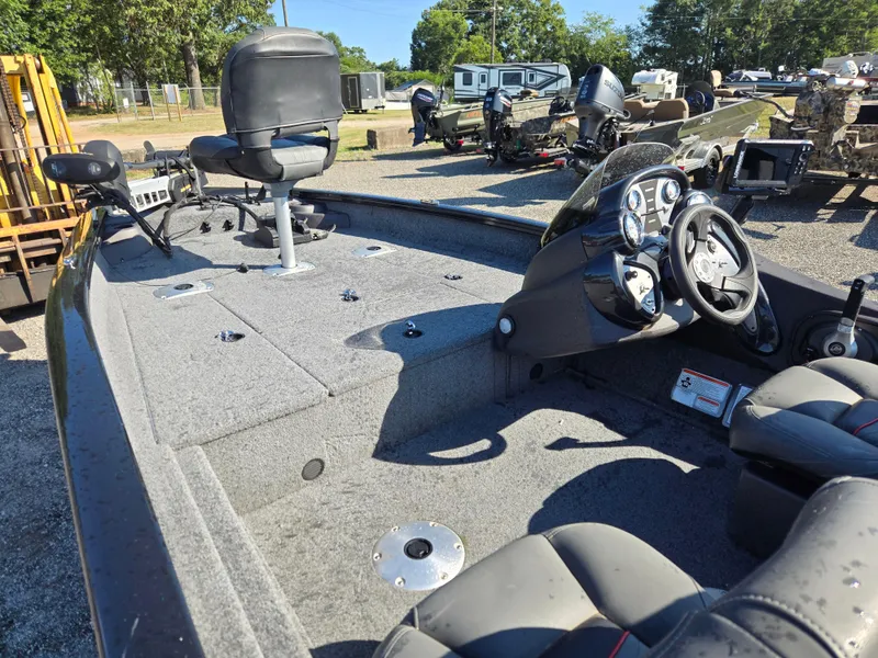 Slide: The Image of 2023 Tracker Pro Team 175 TF boat interior with steering console and seating. - 15