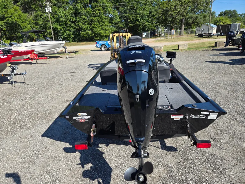 Slide: The Image of 2023 Tracker Pro Team 175 TF boat with Mercury 75 engine, parked outdoors. - 18
